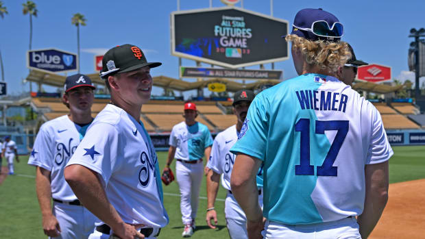 SF Giants prospect Kyle Harrison talks on the field before the All Star-Futures Game at Dodger Stadium. (2022)